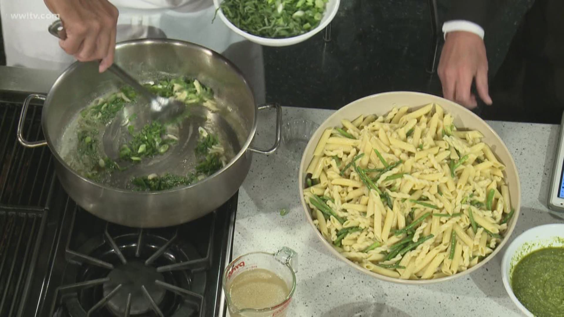 "Basil, Garlic...and drizzle in olive oil." That's the beginning of Chef Kevin Belton's pesto recipe. He shows Eric Paulsen how to put it all together.
