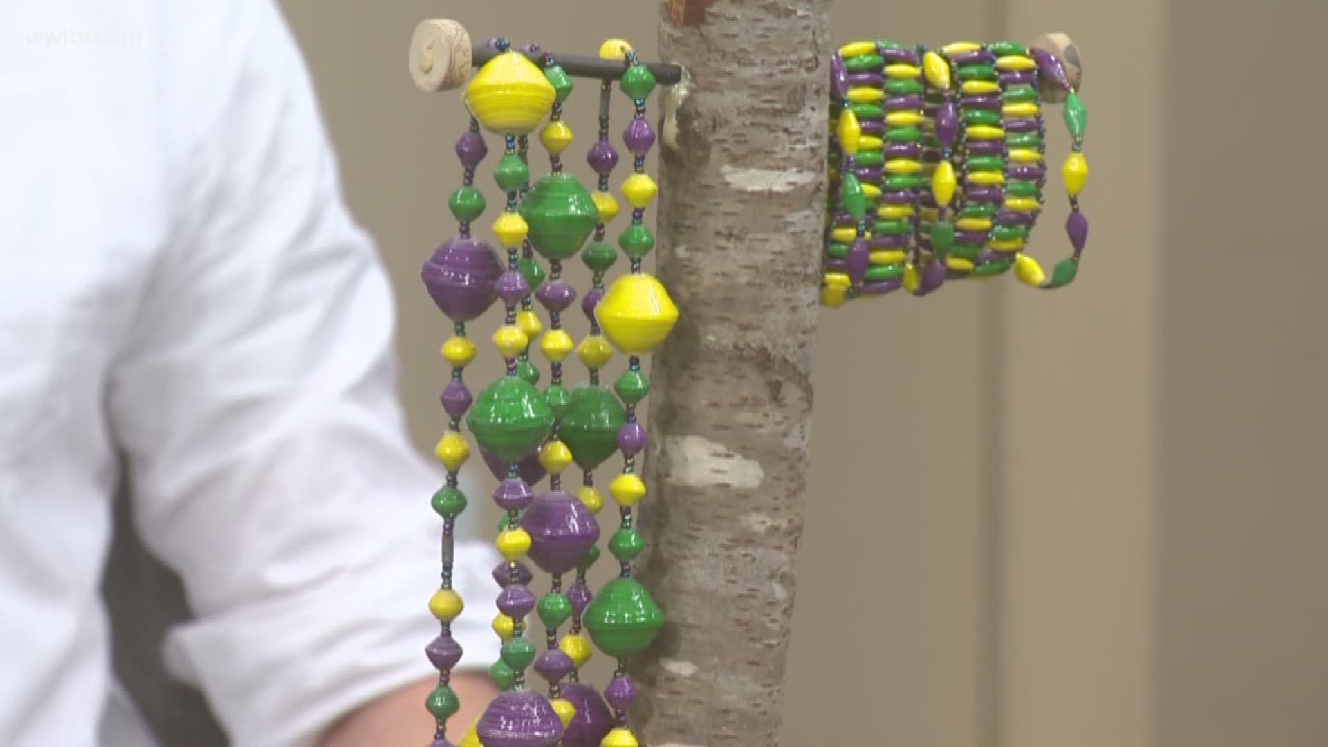 Local Businessman Kevin Fitzwilliam shows off some very unique Mardi Gras beads.