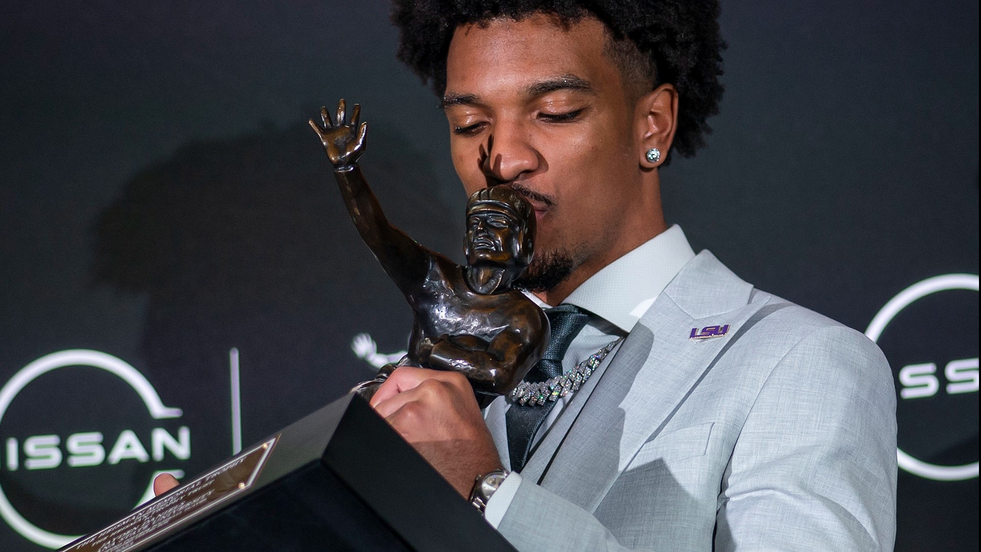 Daniels revealed he slept next to the Heisman the night he won.
