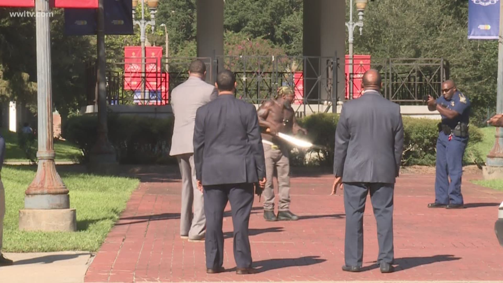 A man has been arrested after arriving in front City Hall with a machete Monday afternoon. 