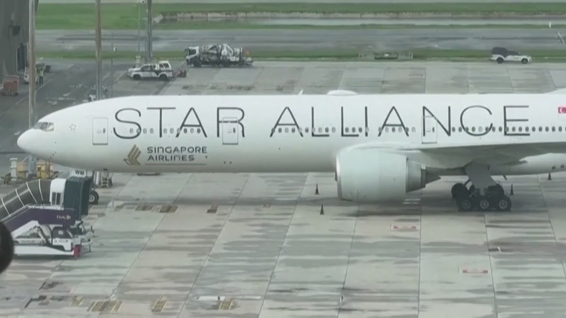 Video from the aftermath of the extreme turbulence event on a Singapore Airlines flight shows a man being carried off the plane on a stretcher.