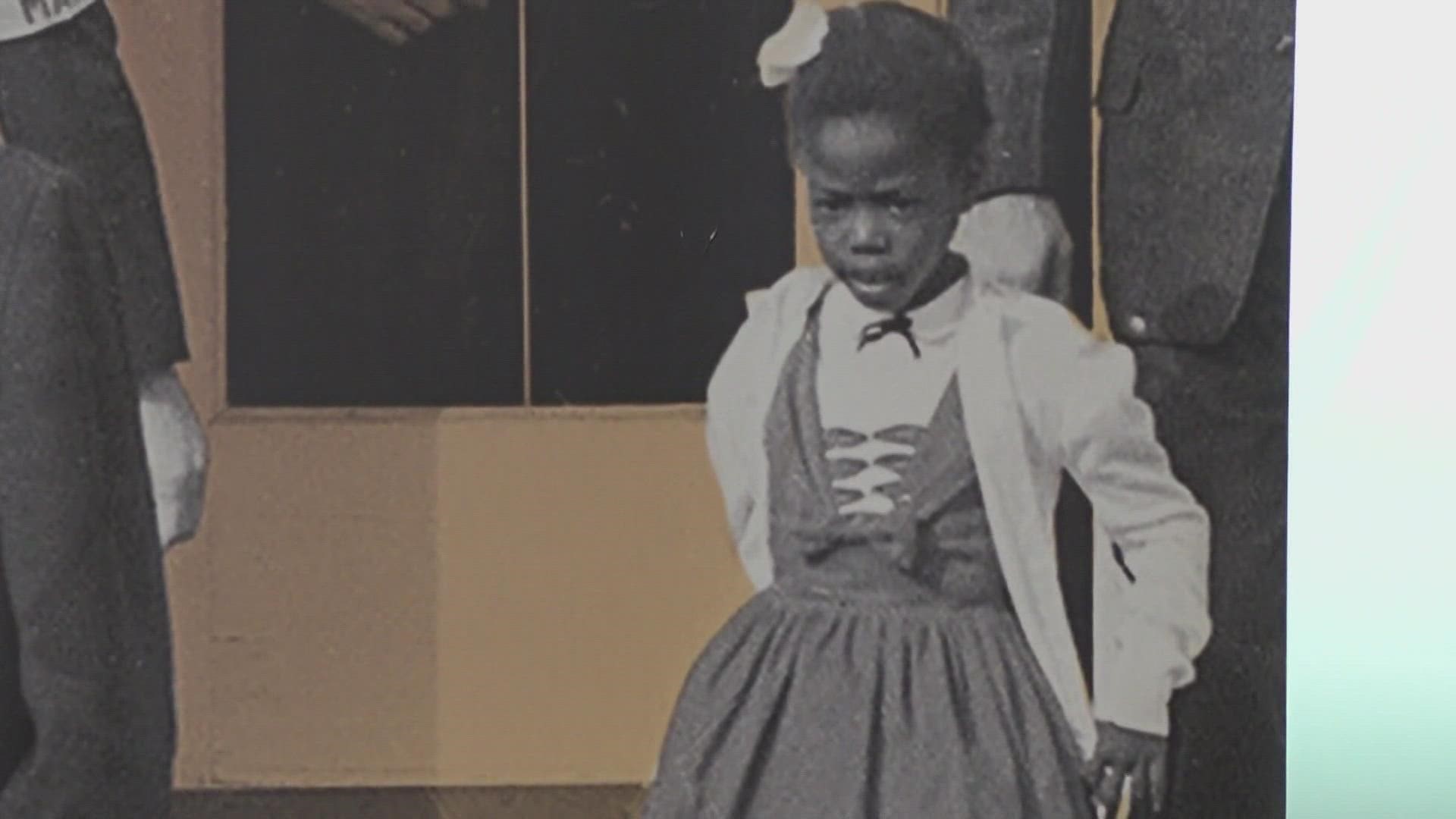 Four U.S. Marshals escorted Ruby Bridges, then six years old, into the school while angry crowds shouted and threatened her.