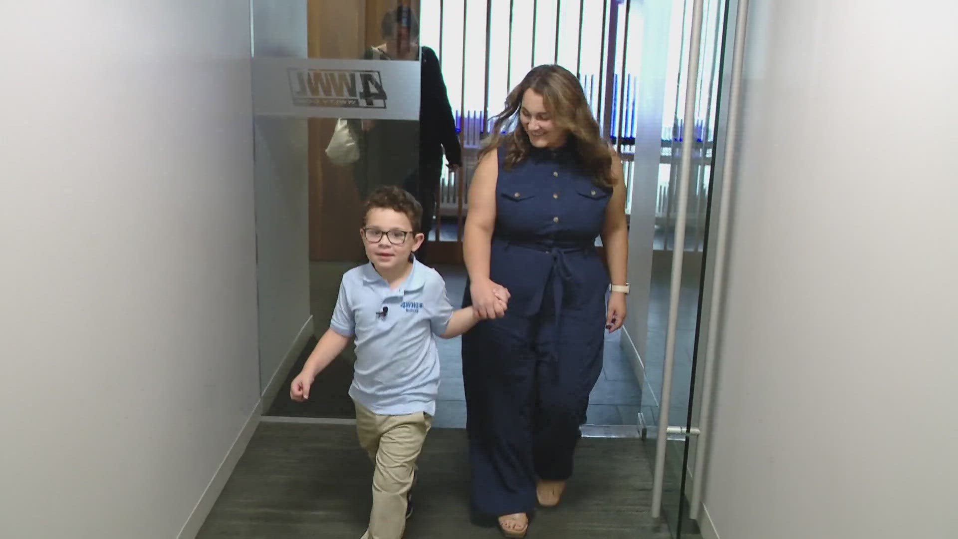 Young WWL fan, Russell Landry, visits the WWL studio and meets the crew.