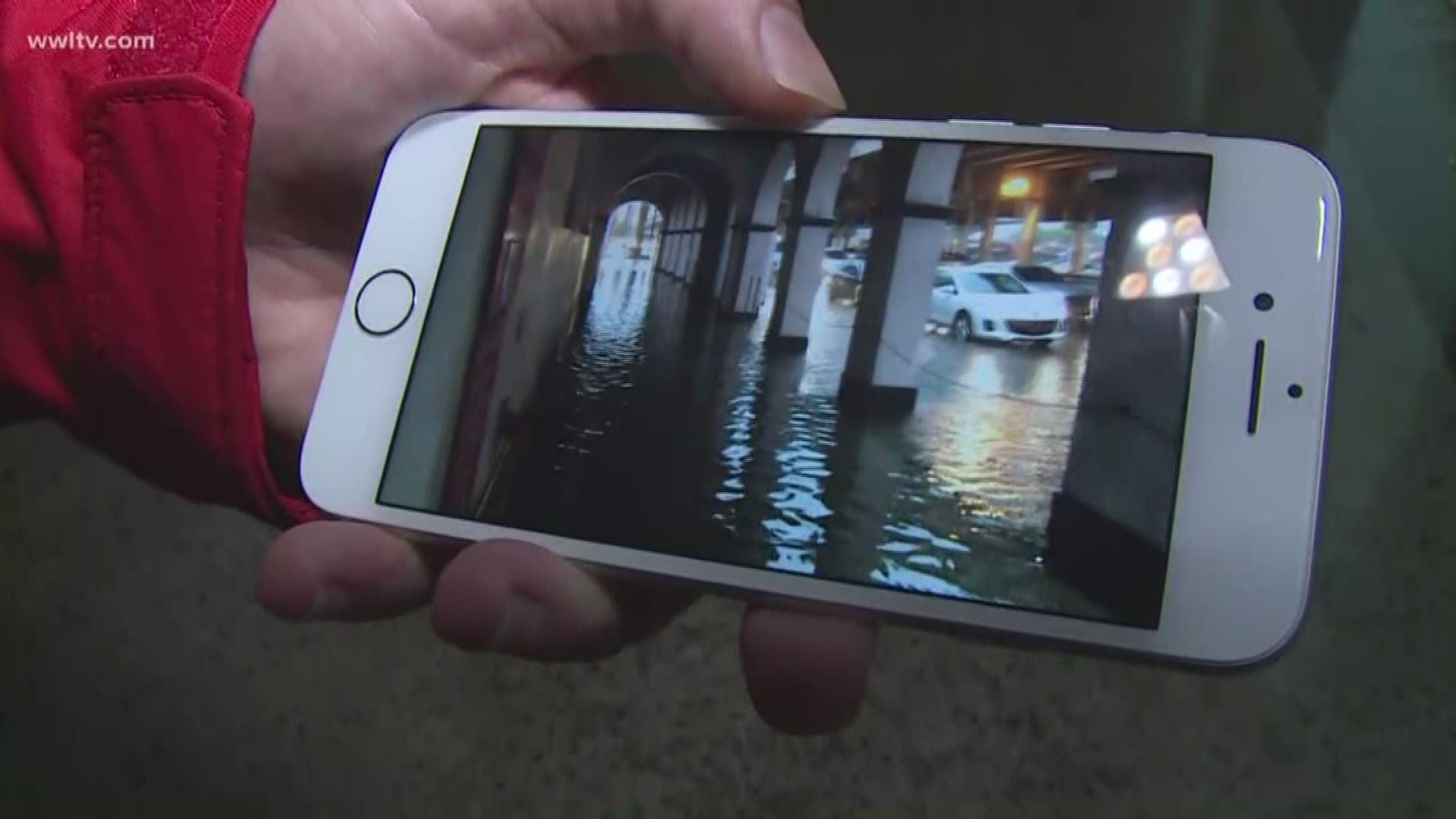 Paul Dudley shows video of the flooding near Circle Food Store at Claiborne and St. Bernard Avenues. 