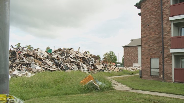 Massive pile of trash at apartment complex has residents crying foul