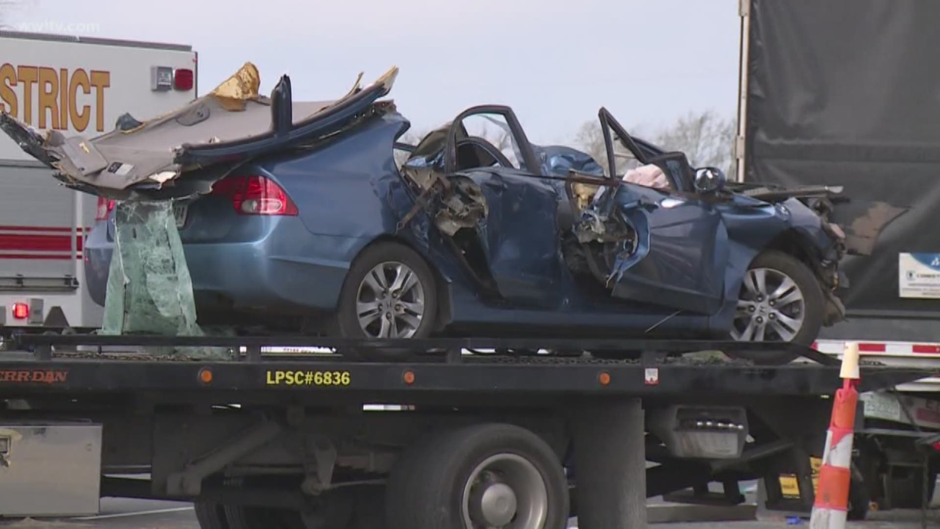 The driver and one passanger were killed after the car veered into a semi truck parked on the shoulder.