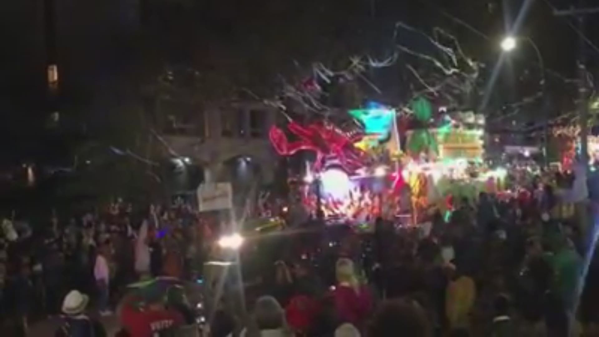 The Krewe of Bacchus and its well-lit floats roll down St. Charles Avenue early Saturday night.