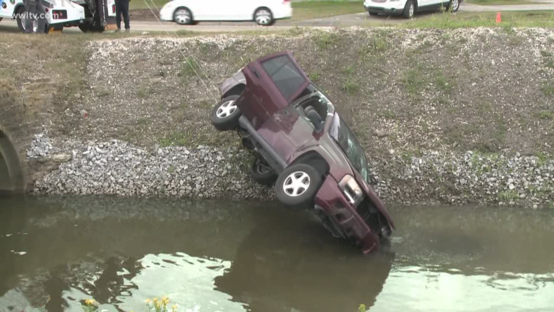 A driver was pulled out of an SUV after the vehicle crashed and turned over in a canal near the intersection of Transcontinental Drive and West Metairie Thursday morning.
