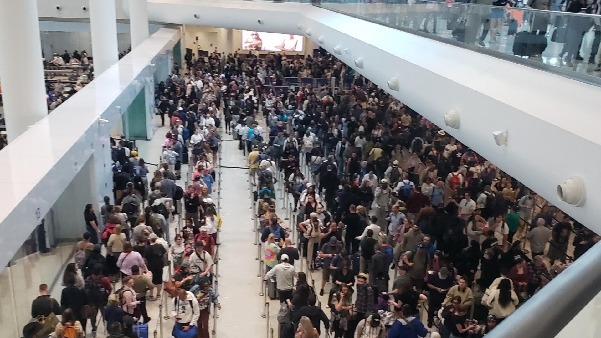 Travelers experiencing long lines at TSA checkpoint at New Orleans ...