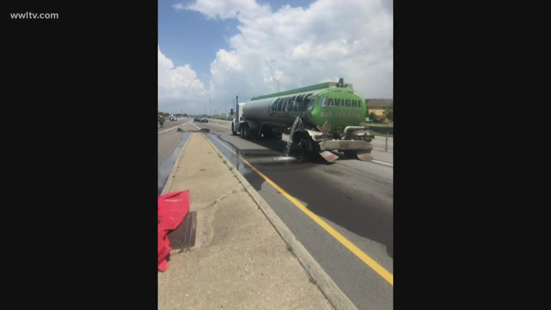 A tanker truck that lost its back two tires and then punctured a fuel tank, which let a lot of gasoline spill onto the highway. 