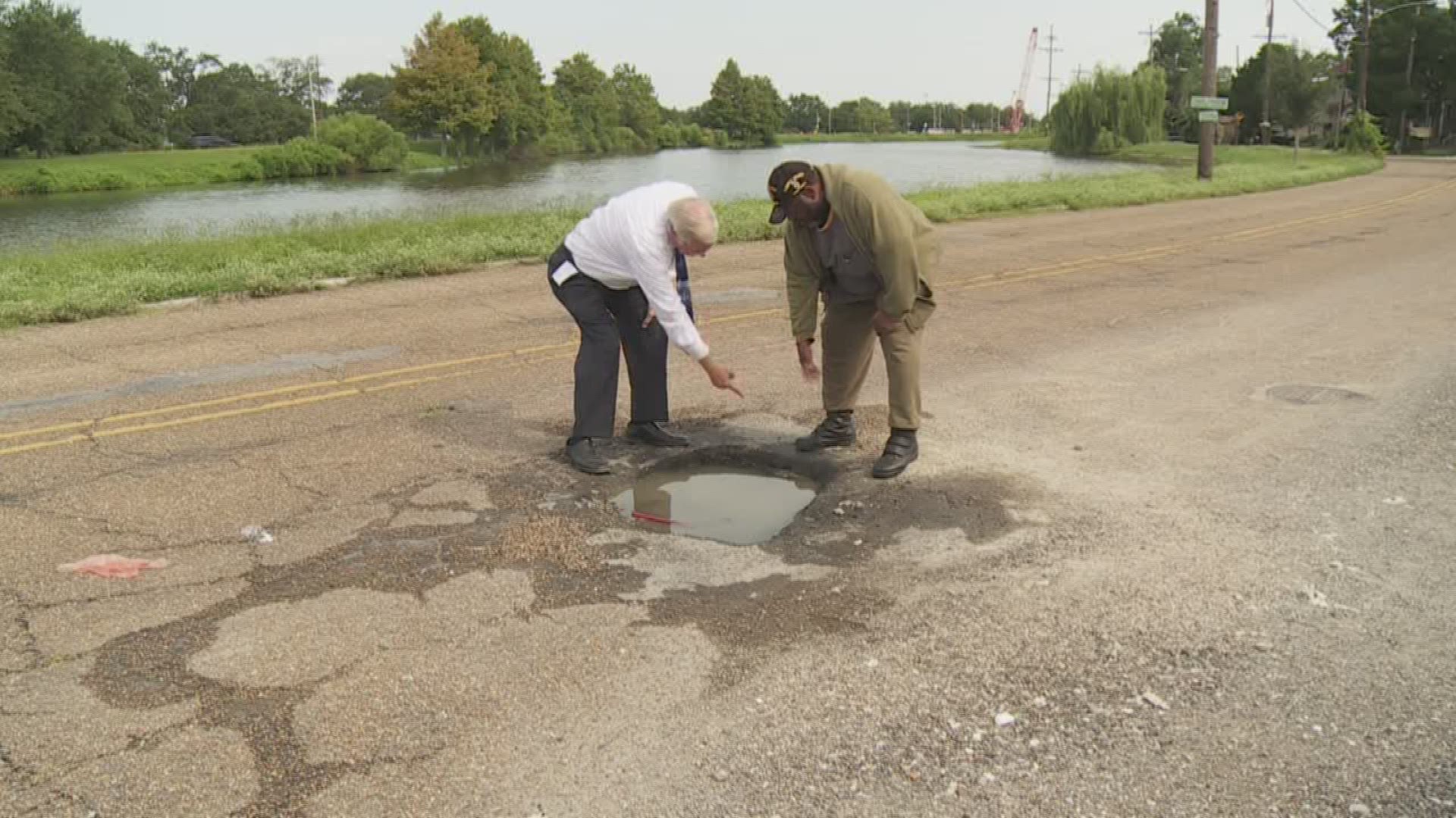 Bill capo talks to a retired police officer who says he was injured when his car hit a pothole in front of his old police station.