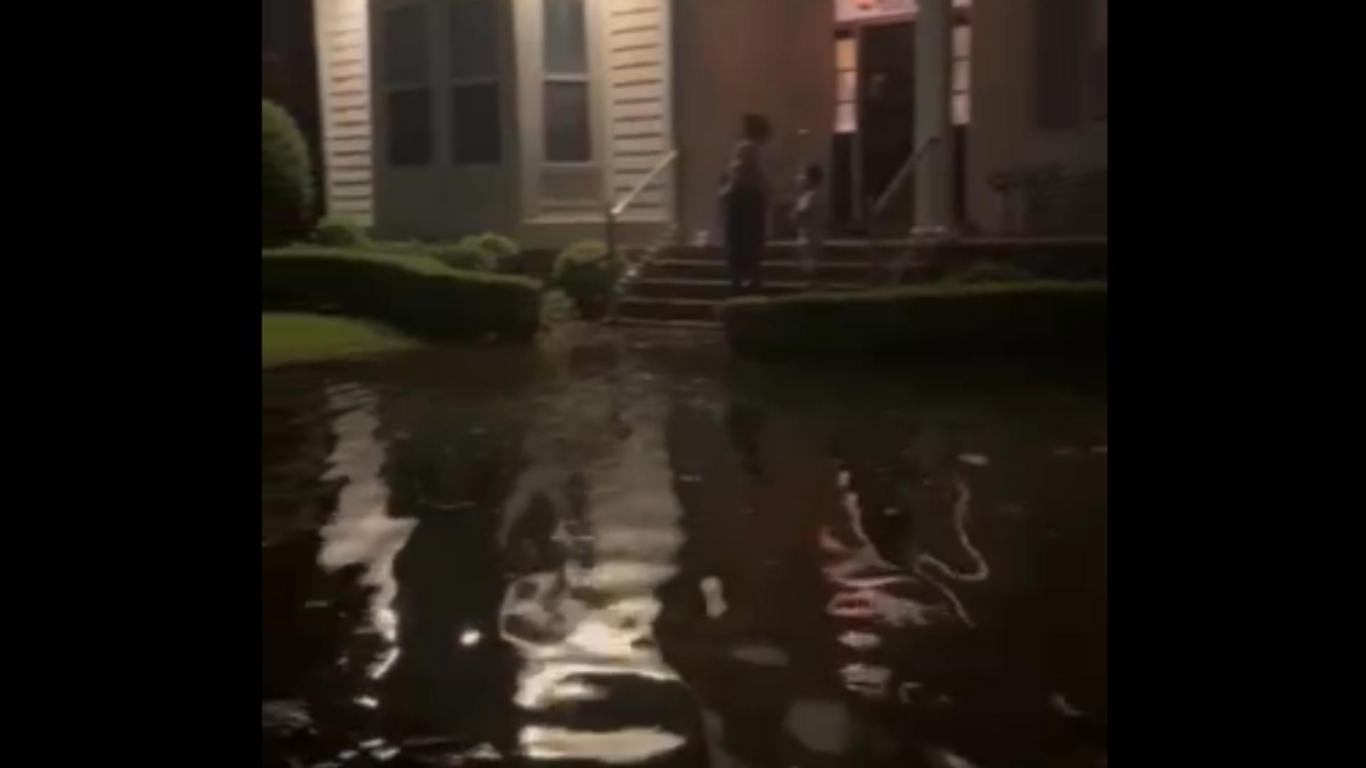 Flood waters reach the steps of a home in Lake View