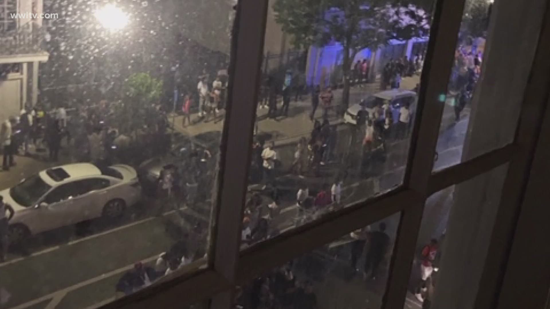 Cellphone video showed a large crowd gathering outside 808 Baronne Street in New Orleans on Friday night around ten.