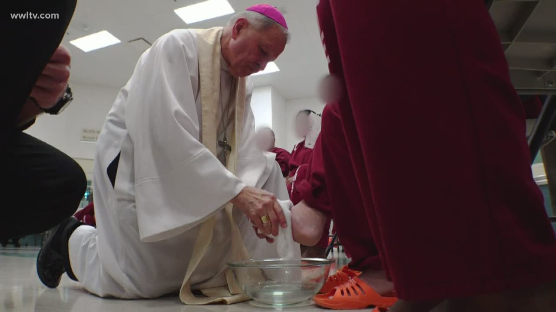 New Orleans Archbishop Gregory Aymond washed the feet of prisoners Thursday in what has become a new tradition.