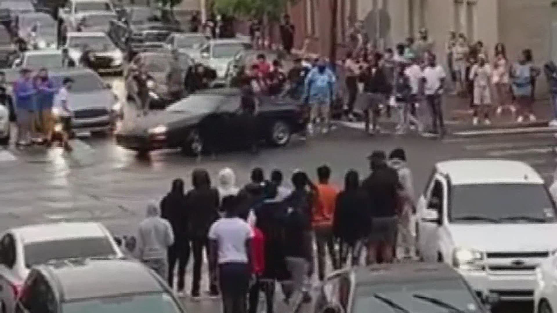 Video shows streets blocked off and cars burning rubber in front of enthusiastic spectators in New Orleans' Warehouse District.