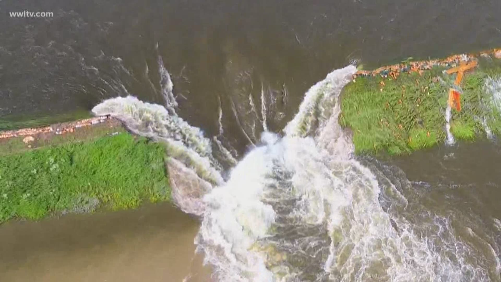 Aerial video posted by the Winfield Police Department on Facebook showed a large breach in the levee with water rushing through the gap. Floodwaters also continue to flow over the top of several sections of the levee.