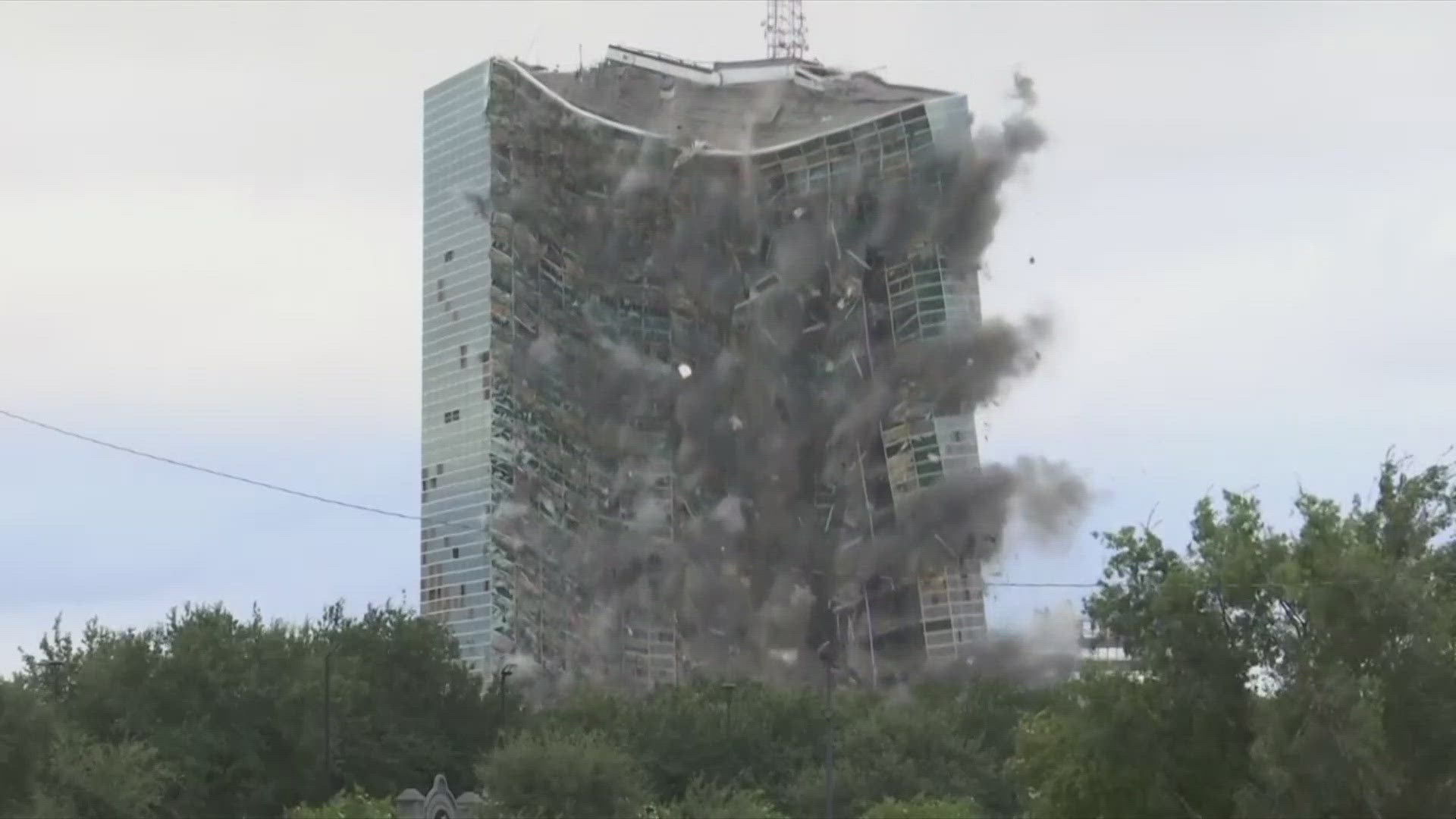 The once gleaming building in Lake Charles came down Saturday after the demolition crew set off a series of explosions inside.