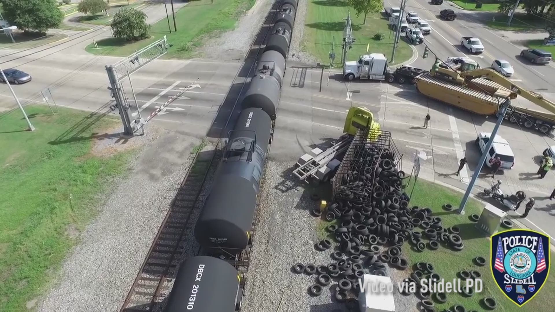 Slidell Police released aerial video after a train crashed into a truck that was carrying hundreds of tires.