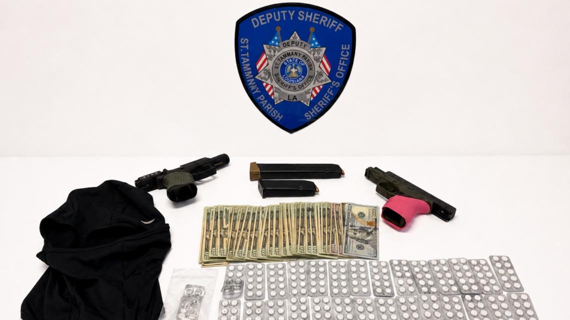 Deputies say nearly 300 pills, two pistols and cash were recovered during April 30 stop