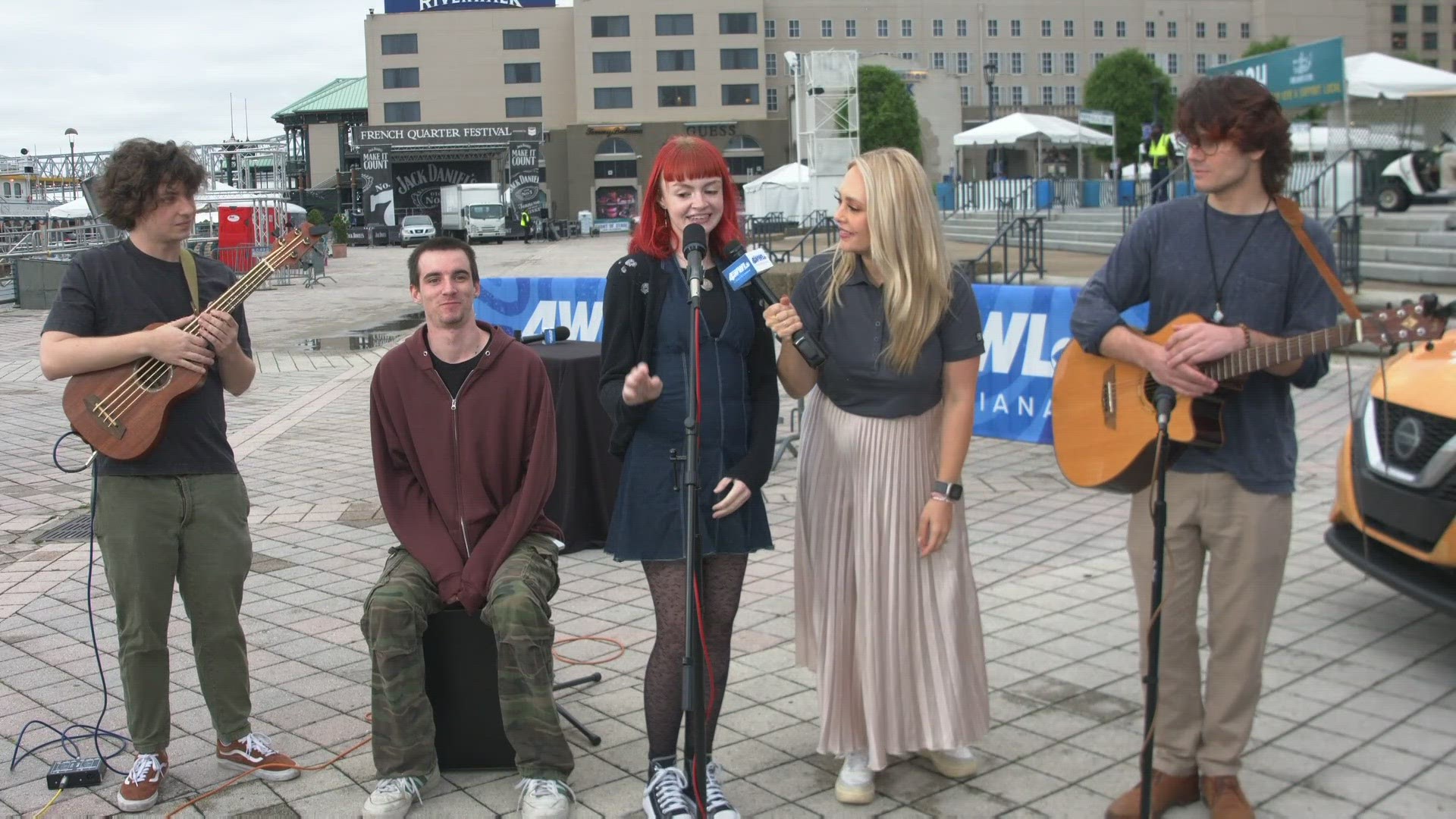 WWL Louisiana's Brheanna Boudreaux talks with the Loyola University student rock band The Kissing Disease on their first experience performing at the FQF.