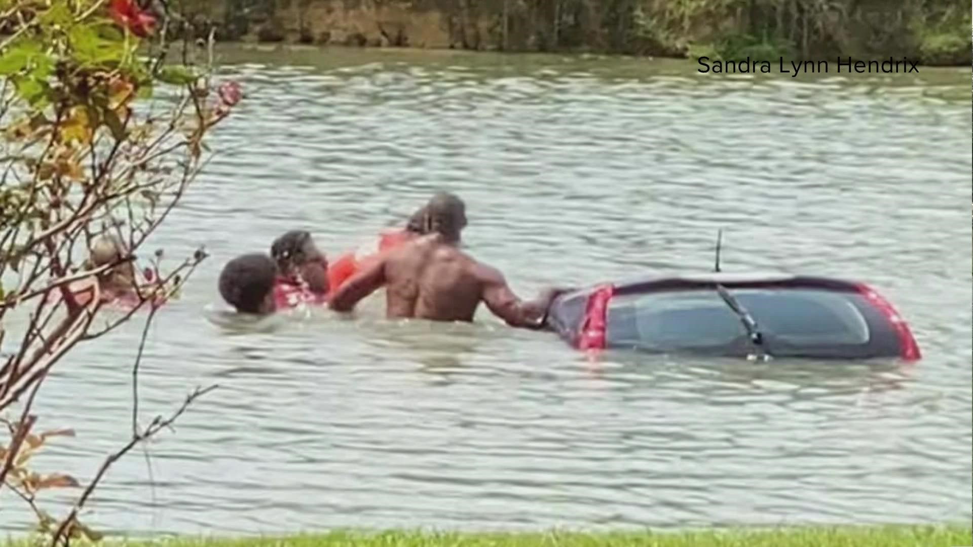 Several strangers jumped into a pond to rescue woman who lost control of her vehicle because of a medical issue.