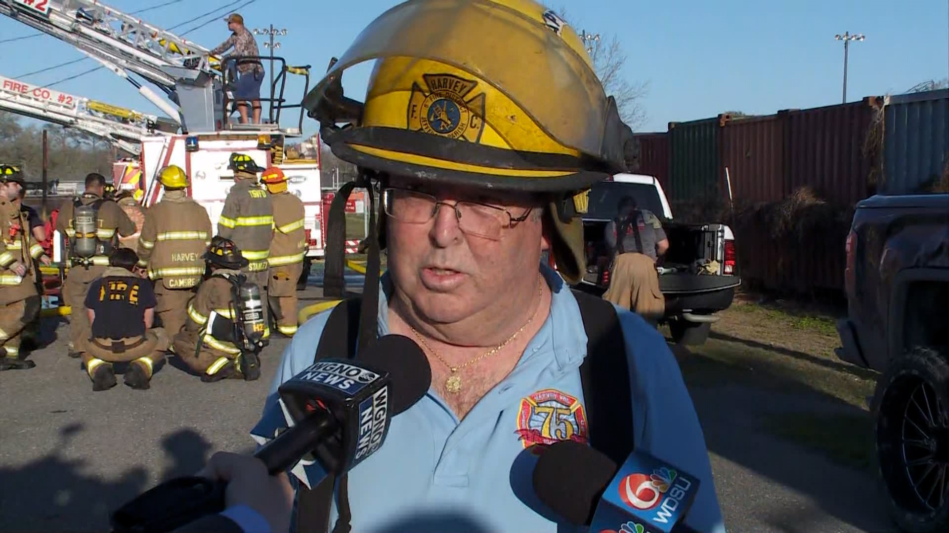 The Harvey Volunteer Fire Company No. 2 Captain Michael McAuliffe talks to media from the scene of a burning home on in the 2000 block of Estalote Avenue on Friday.