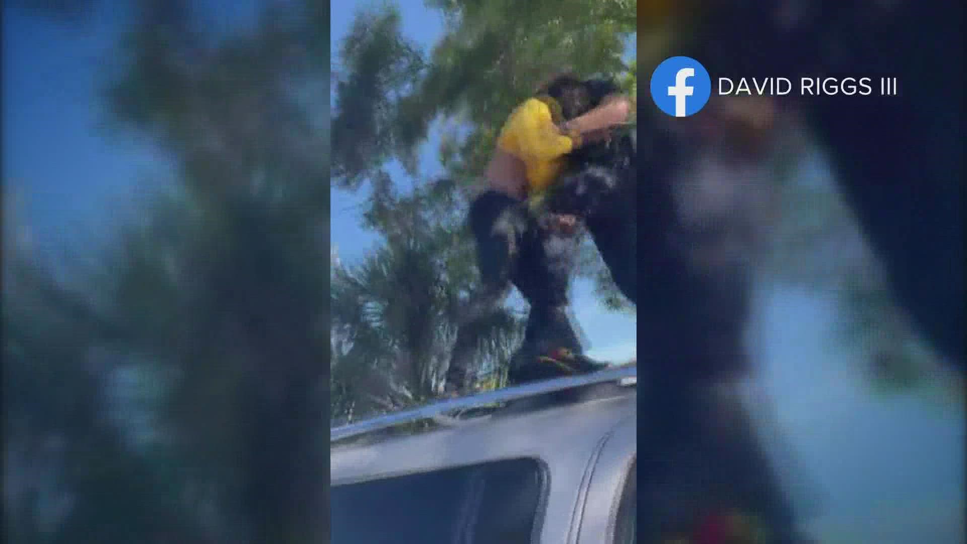 The standoff and struggle were captured in a Facebook livestream that appears to have been started by the person on the roof of the SUV.