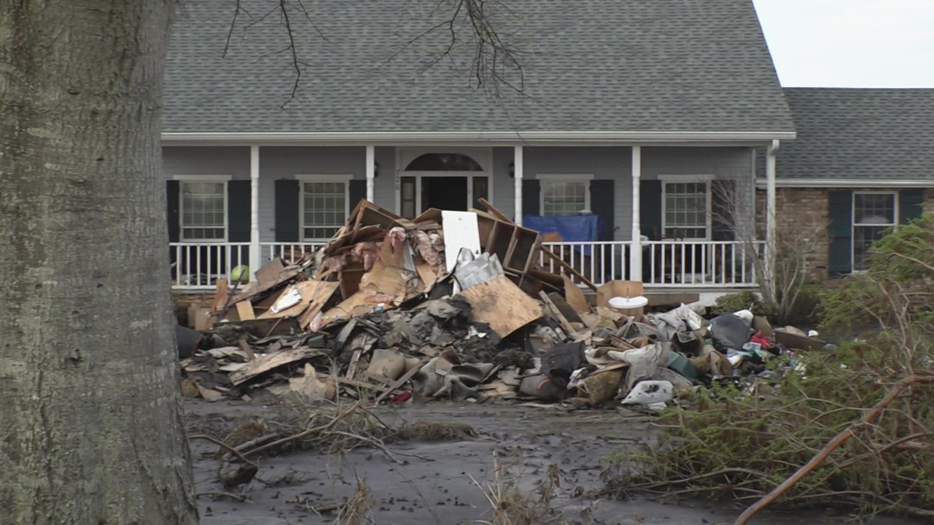 A home that once had a lush green lawn is now nothing but mud and dead fish after Hurricane Ida brought a surge and flooded the area and homes.