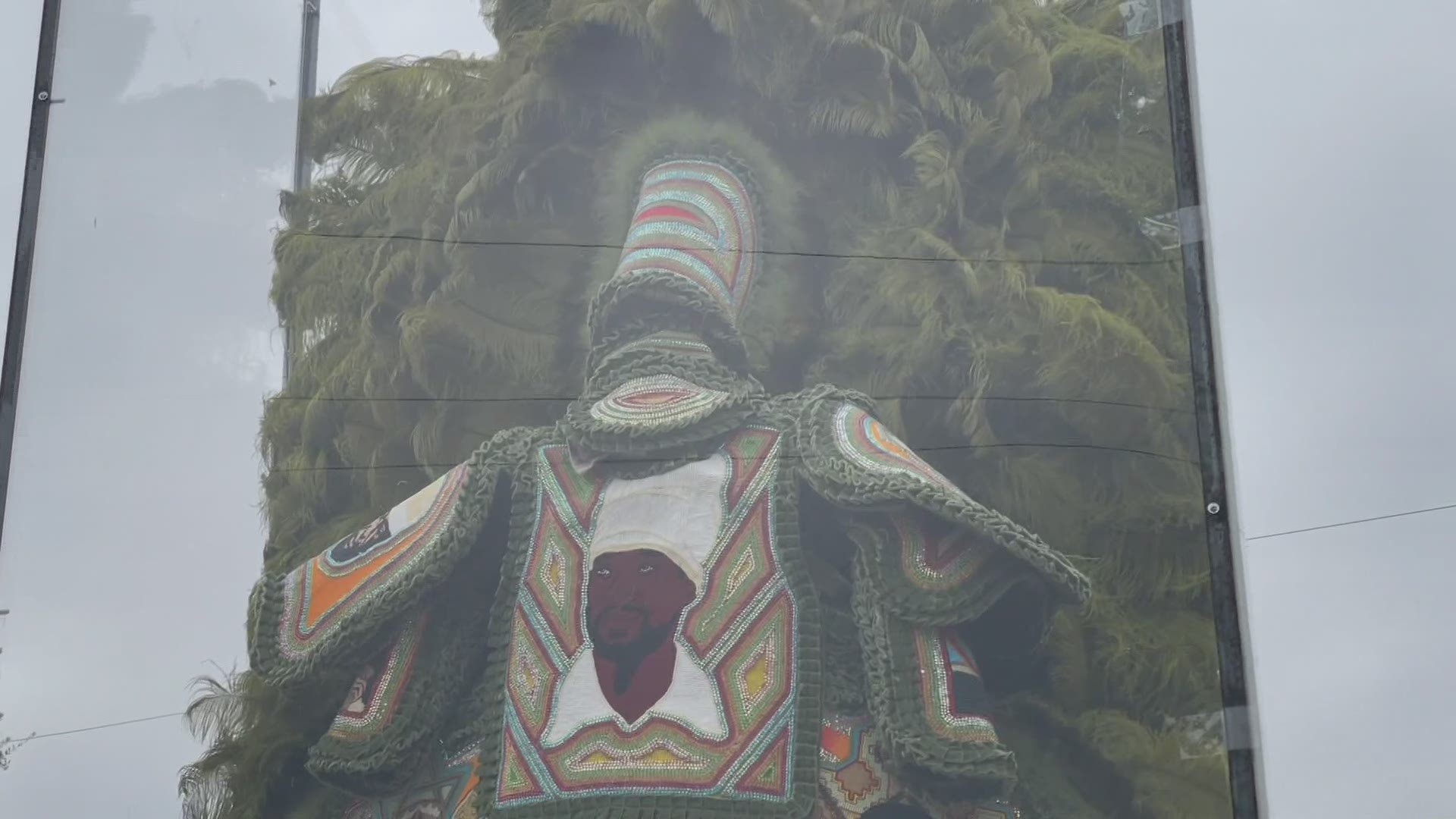 A Mardi Gras Indian suit encased in a protective closure was placed at the site of the old Jefferson Davis monument and could be seen by all Tuesday.