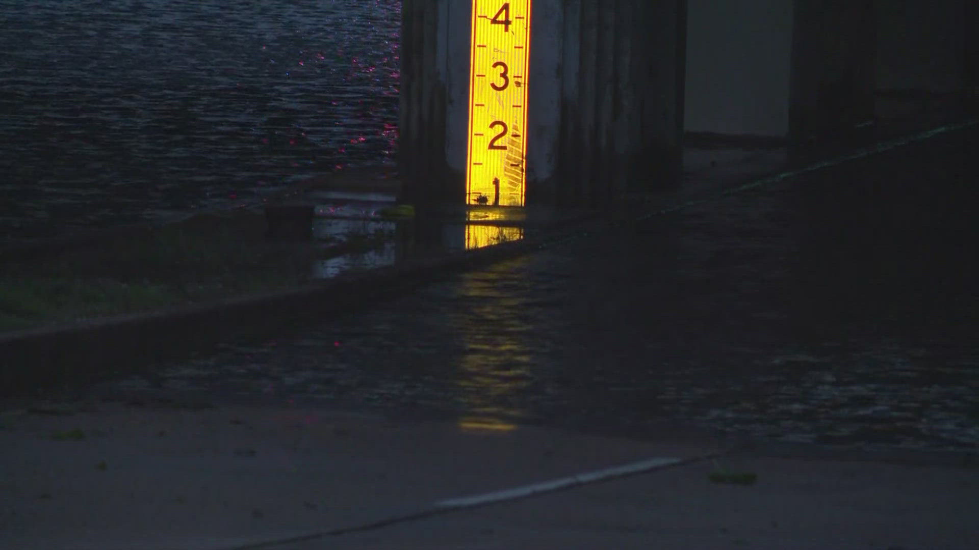 WWL Louisiana's Winston Reed reporting on traffic conditions at the South Carrollton Underpass following Hurricane Francine in New Orleans on Thursday, Sept. 12.