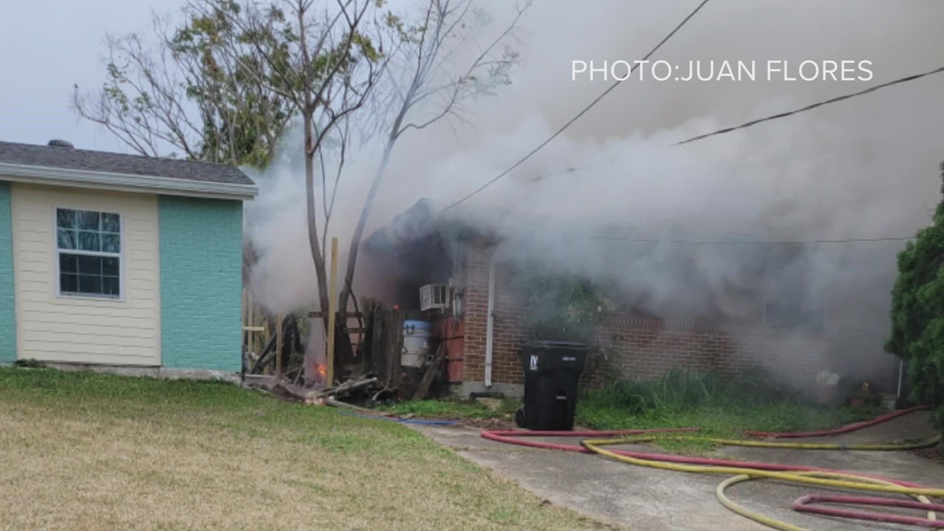 A woman is in critical but stable condition after being pulled from a house fire in Kenner Monday.